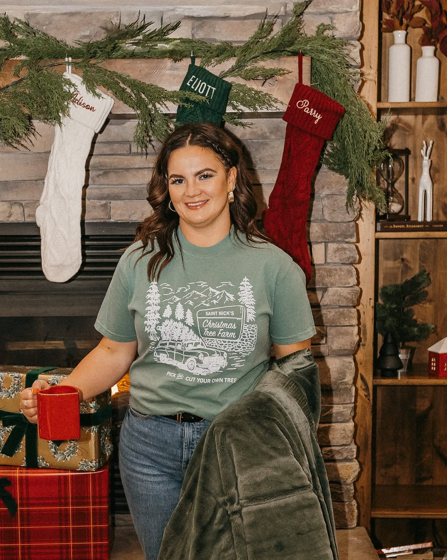 Comfort Colors Tee in light green with St. Nick's Christmas Tree Farm graphic on the front, shown on model – Little Mama Shirt Shop