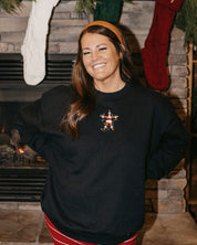 Adult sweater in black with Santa wrapped in lights embroidery on front, shown on model – Little Mama Shirt Shop