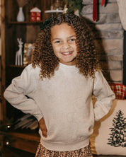 Child fleece in natural with printed ginger bread family pattern, shown on model – Little Mama Shirt Shop