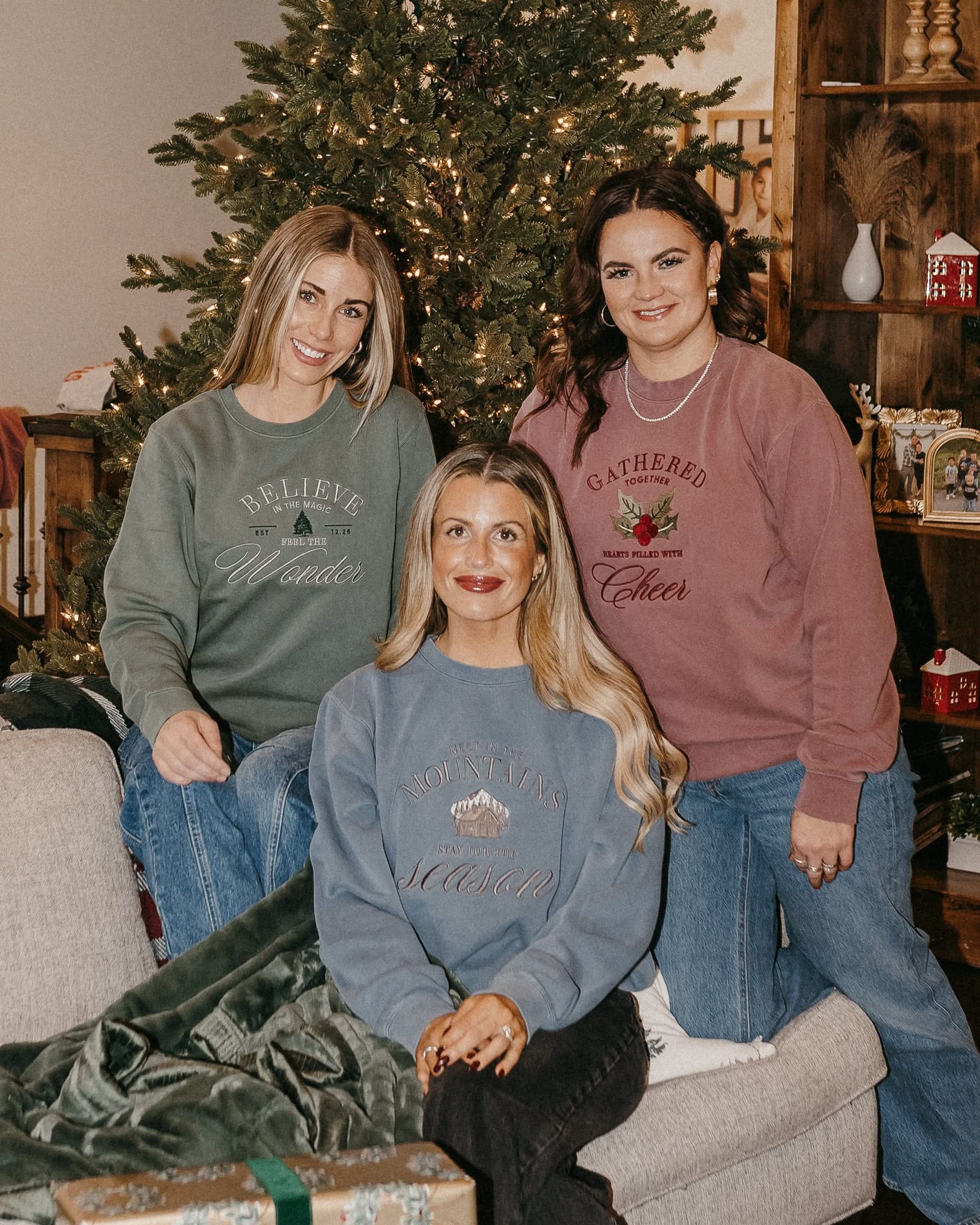 Adult sweater in alpine, maroon, and slate with The Winter Lodge collection designs on front, shown on models – Little Mama Shirt Shop