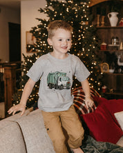 Child tee in gray with Christmas Garbage Truck on front, shown on model – Little Mama Shirt Shop