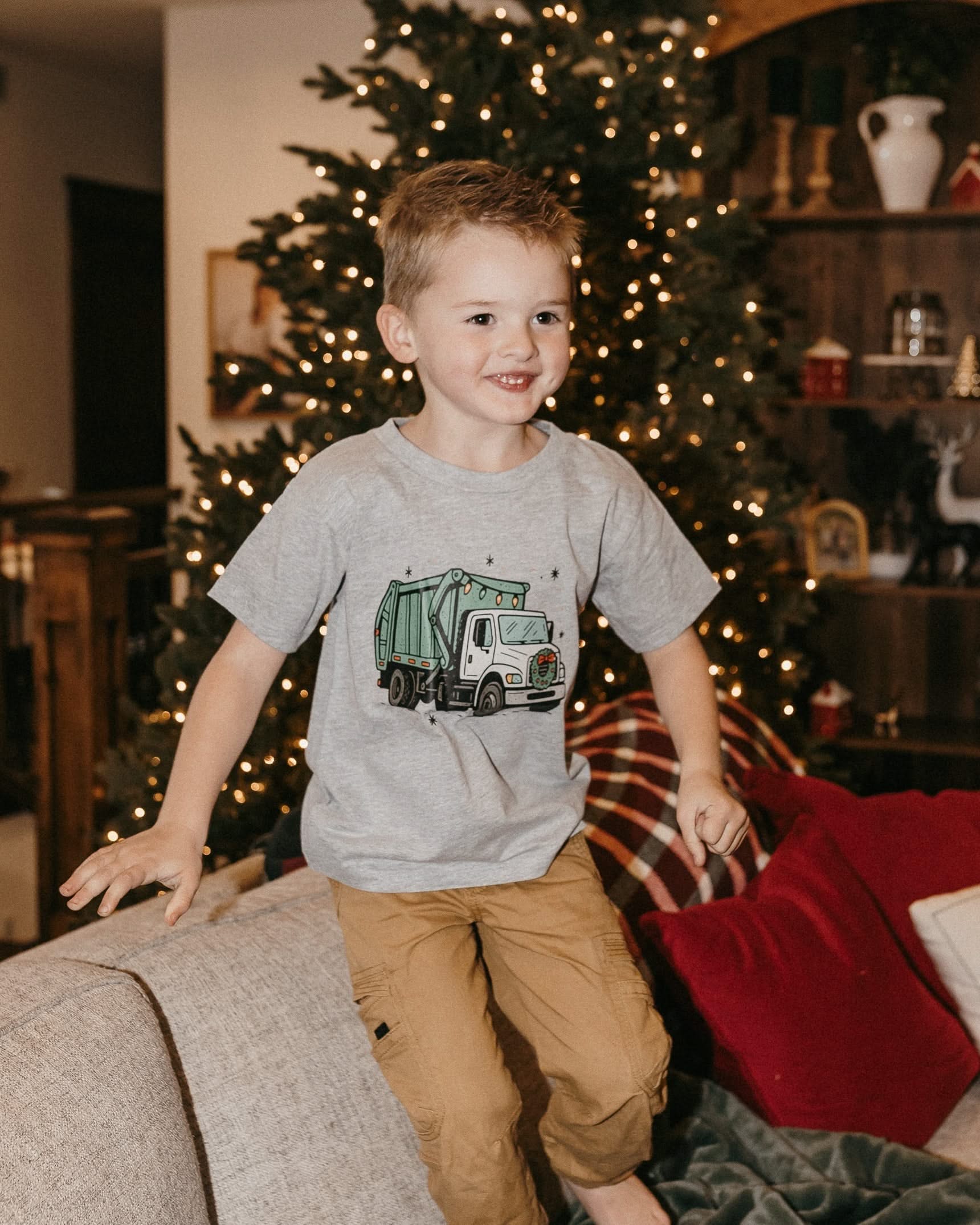 Child tee in gray with Christmas Garbage Truck on front, shown on model – Little Mama Shirt Shop