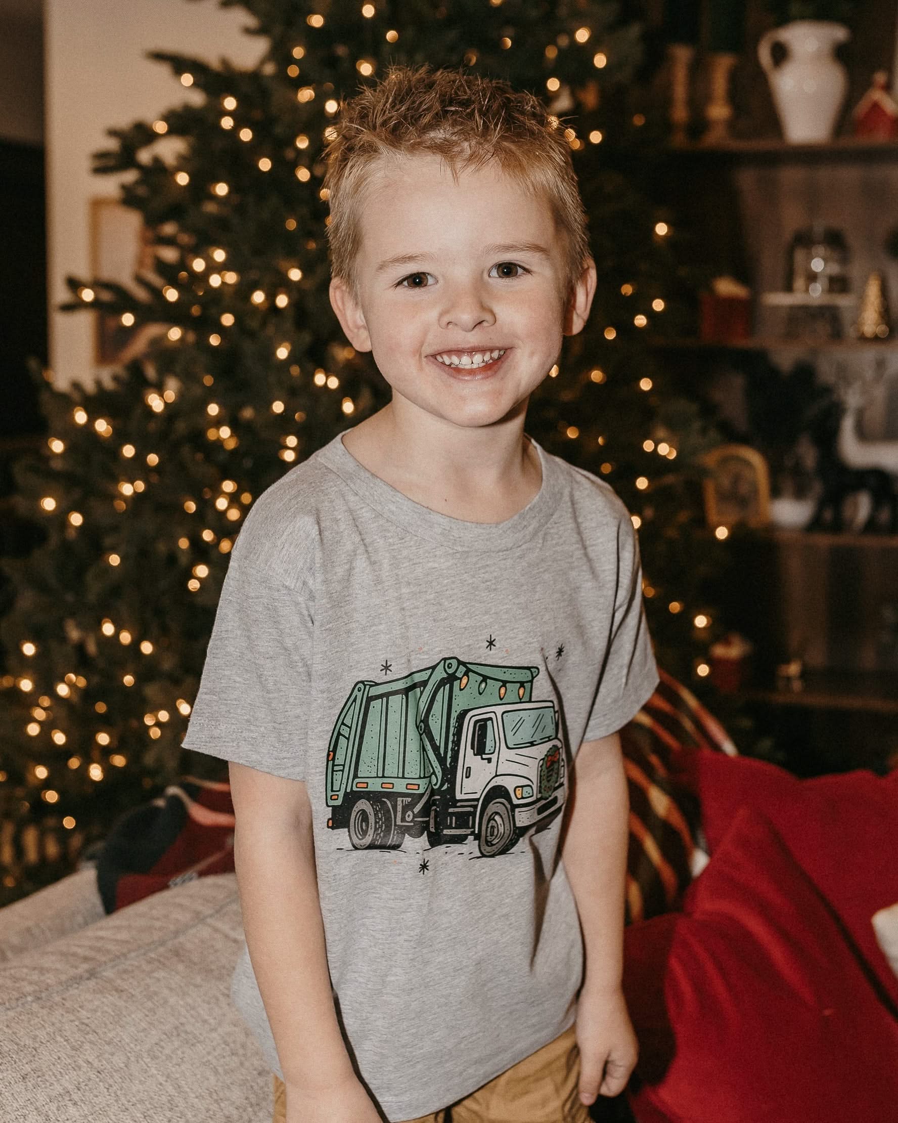 Child tee in gray with Christmas Garbage Truck on front, shown on model – Little Mama Shirt Shop