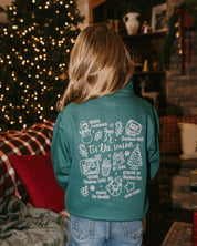 Kids quarter zip in green with Christmas collage printed on back, shown on model – Little Mama Shirt Shop
