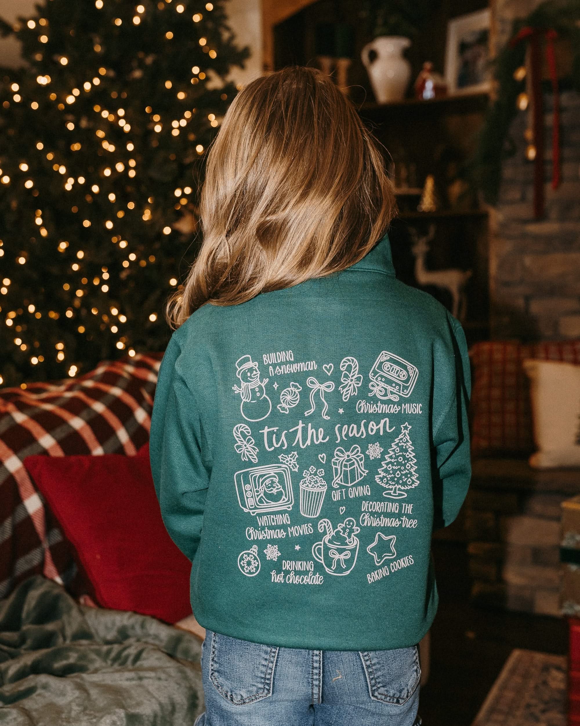 Kids quarter zip in green with Christmas collage printed on back, shown on model – Little Mama Shirt Shop