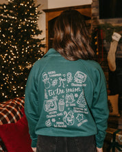 Adult quarter zip in green with Christmas collage printed on back, shown on model – Little Mama Shirt Shop