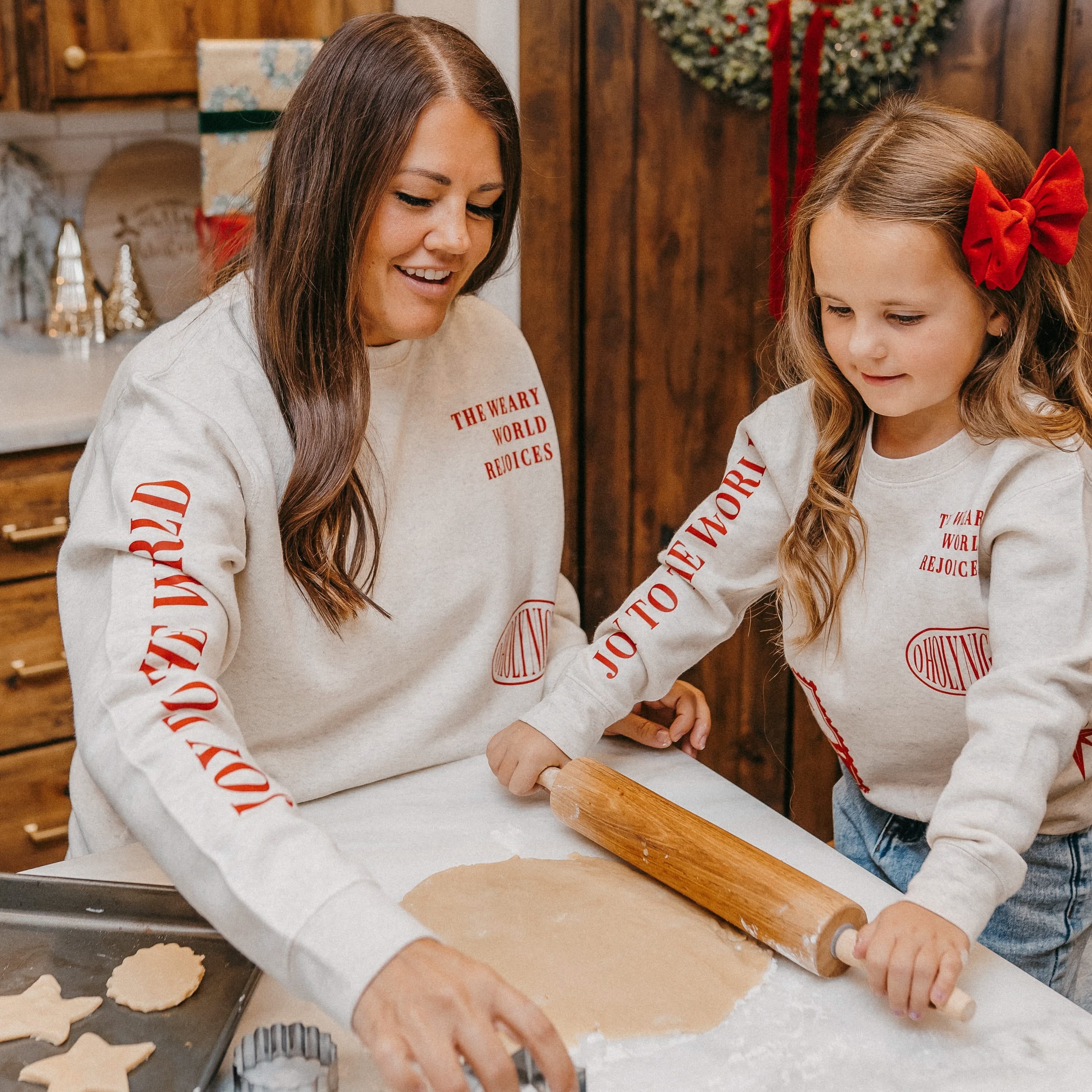 Adult sweater in natural with Christian Christmas graphics on the front, shown on model – Little Mama Shirt Shop
