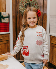 Child sweater in natural with Christian Christmas graphics on the front, shown on model – Little Mama Shirt Shop