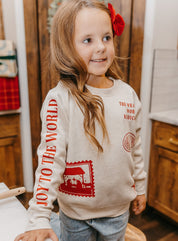 Child sweater in natural with Christian Christmas graphics on the front, shown on model – Little Mama Shirt Shop