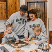 Adult and Kids basic fleece in gray with personalized last name printed on front with Christmas lights under, shown on models – Little Mama Shirt Shop