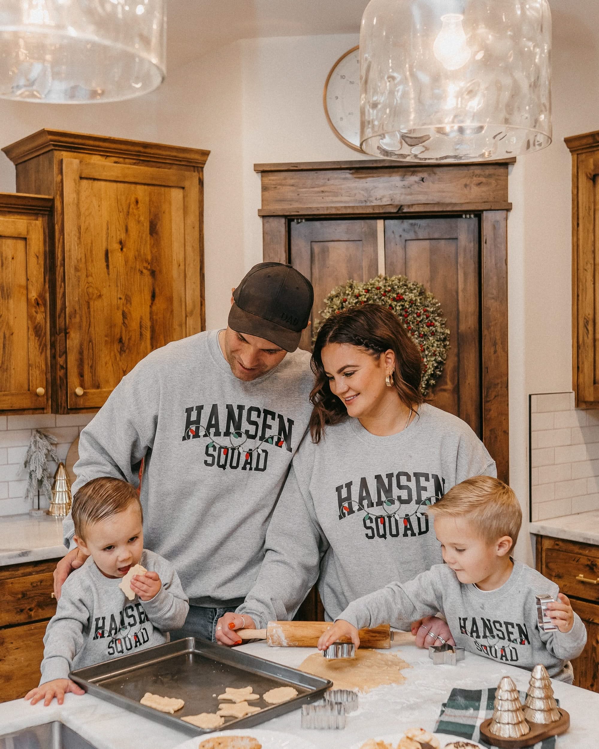 Adult and Kids basic fleece in gray with personalized last name printed on front with Christmas lights under, shown on models – Little Mama Shirt Shop