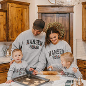 Adult and Kids basic fleece in gray with personalized last name printed on front with Christmas lights under, shown on models – Little Mama Shirt Shop