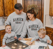 Adult and Kids basic fleece in gray with personalized last name printed on front with Christmas lights under, shown on models – Little Mama Shirt Shop
