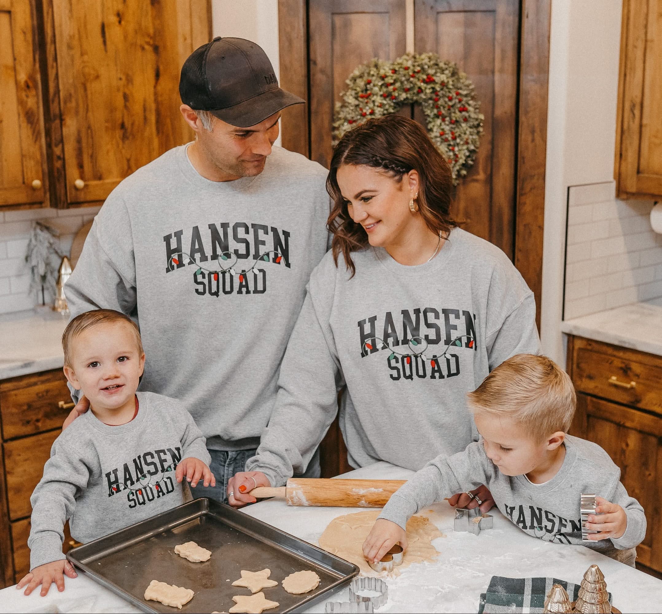 Adult and Kids basic fleece in gray with personalized last name printed on front with Christmas lights under, shown on models – Little Mama Shirt Shop