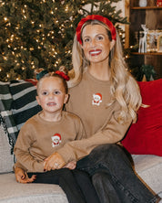 Kids and adult sweater in coyote brown with embroidered Santa teddy bear on front, shown on model – Little Mama Shirt Shop