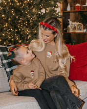 Adult and kid sweater in coyote brown with embroidered Santa teddy bear on front, shown on model – Little Mama Shirt Shop
