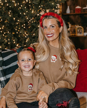 Adult and kid sweater in coyote brown with embroidered Santa teddy bear on front, shown on model – Little Mama Shirt Shop