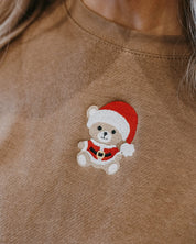 Adult sweater in coyote brown with embroidered Santa teddy bear on front, shown on model – Little Mama Shirt Shop