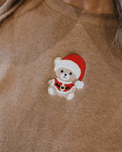Adult sweater in coyote brown with embroidered Santa teddy bear on front, shown on model – Little Mama Shirt Shop
