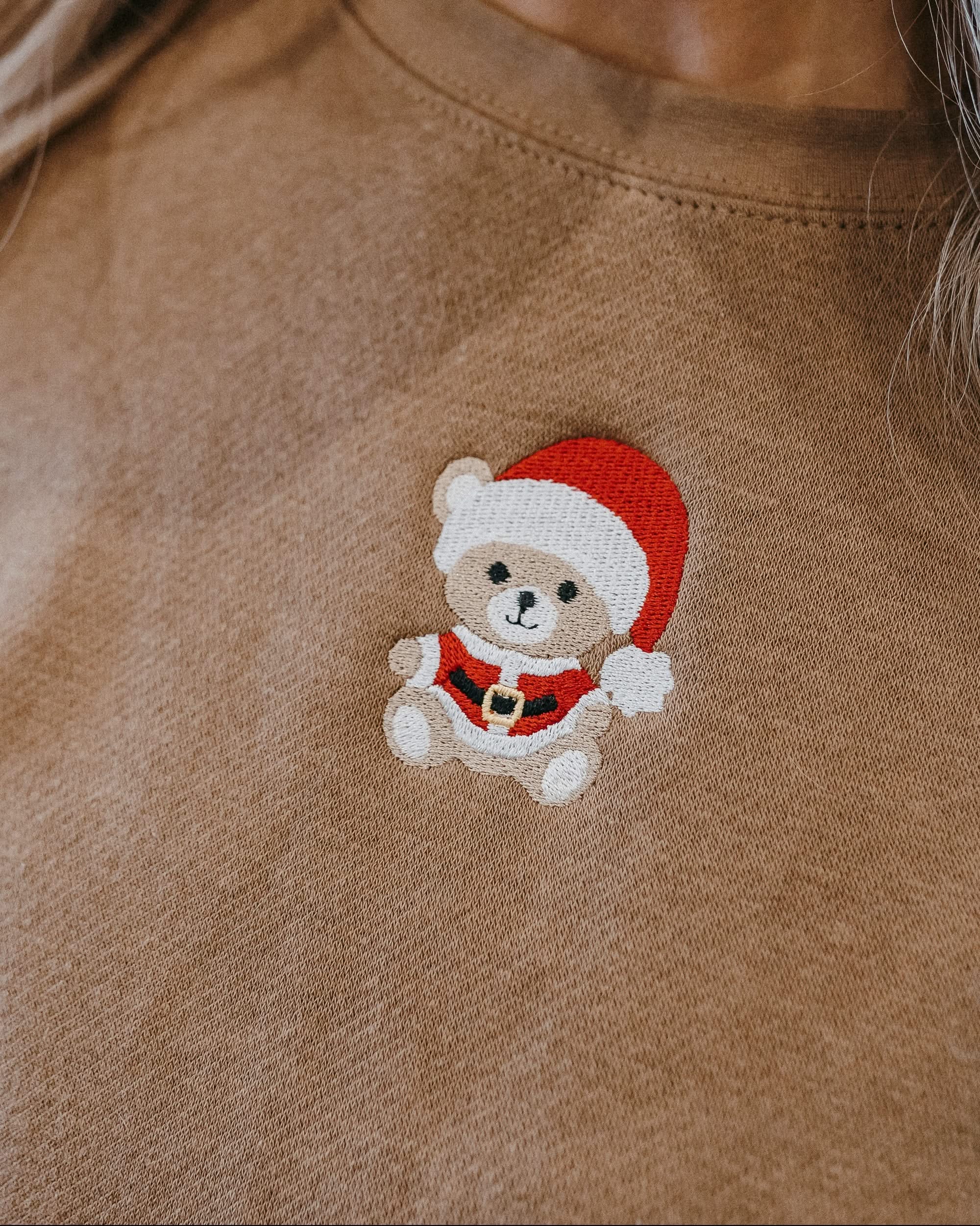 Kids sweater in coyote brown with embroidered Santa teddy bear on front, shown on model – Little Mama Shirt Shop