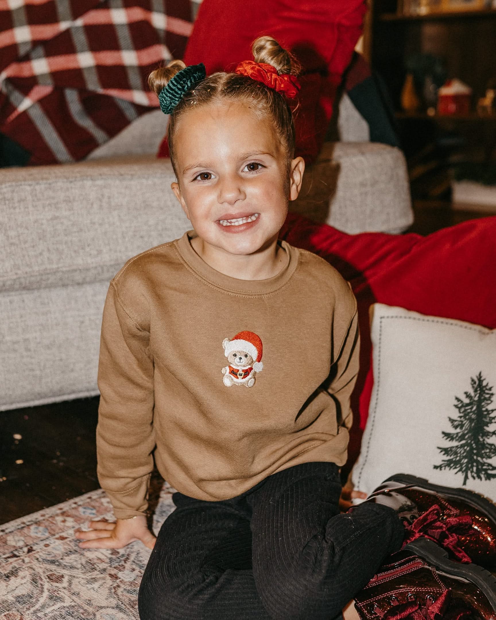 Kids sweater in coyote brown with embroidered Santa teddy bear on front, shown on model – Little Mama Shirt Shop