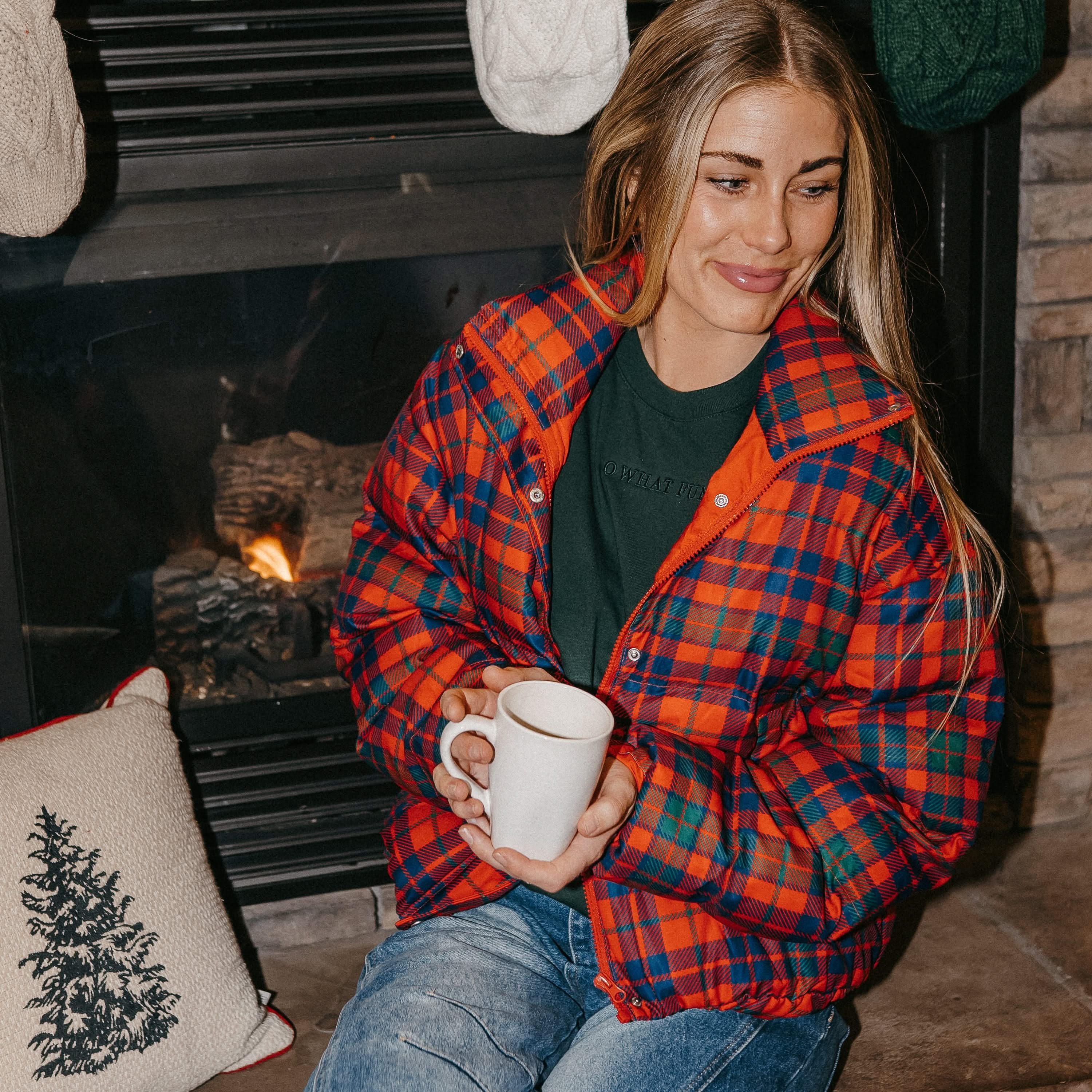 Adult tee in forest with Christmas message on front, shown on model – Little Mama Shirt Shop