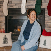 Adult tee in navy with Christmas message on front, shown on model – Little Mama Shirt Shop