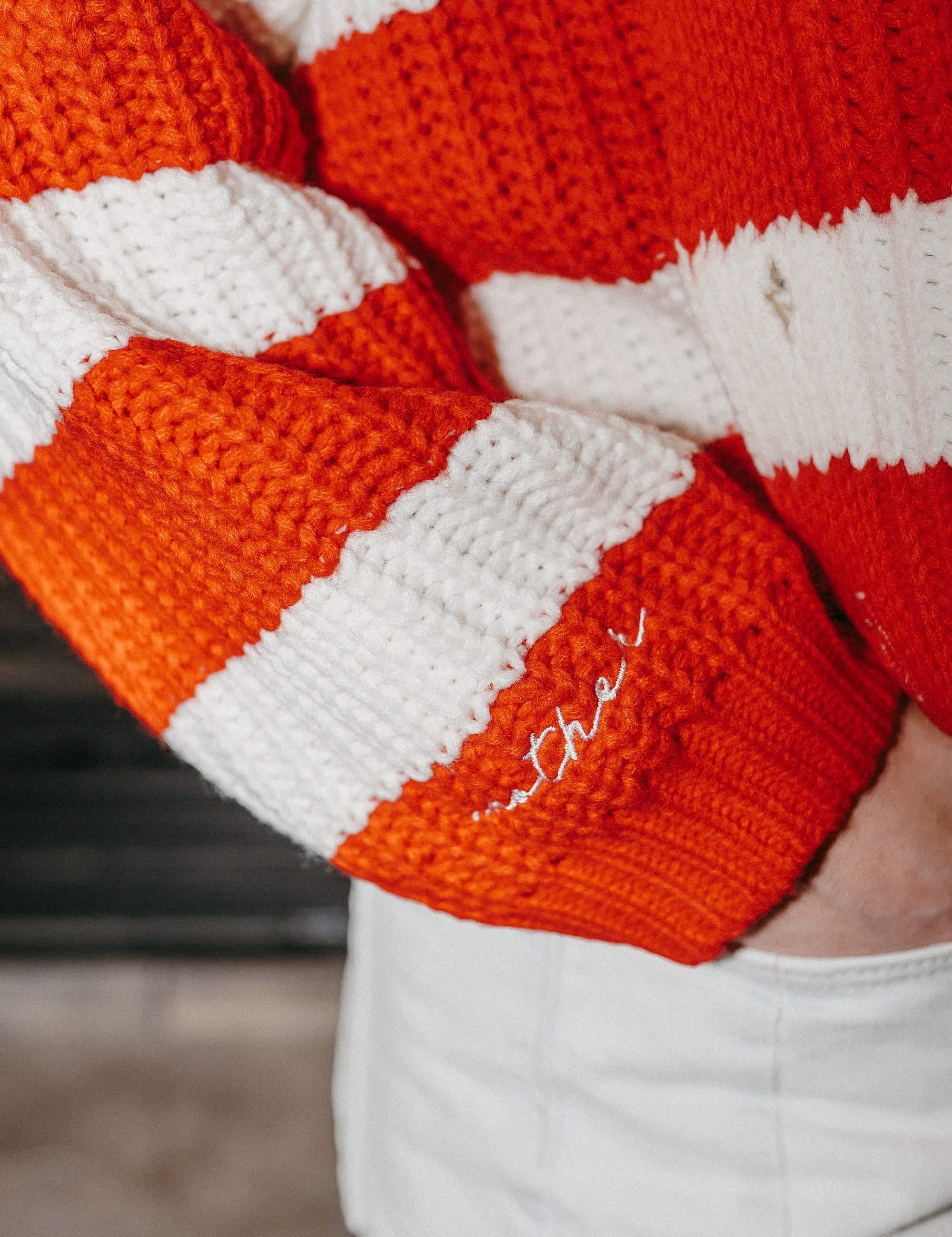 Adult candy cane cardigan with 'mother' embroidered on sleeve, shown on model – Little Mama Shirt Shop