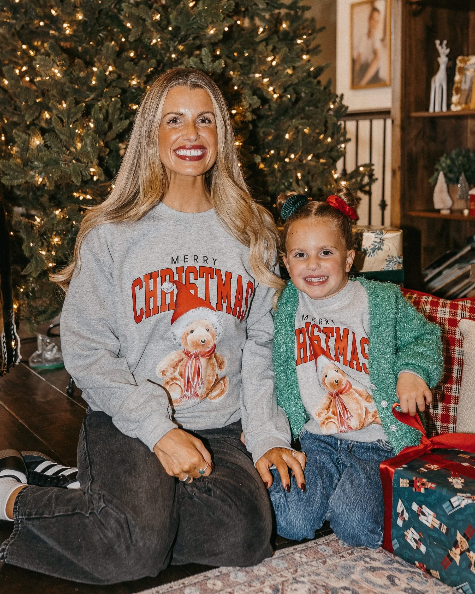 Adult and child gray sweaters with merry Christmas teddy graphic, shown on models – Little Mama Shirt Shop