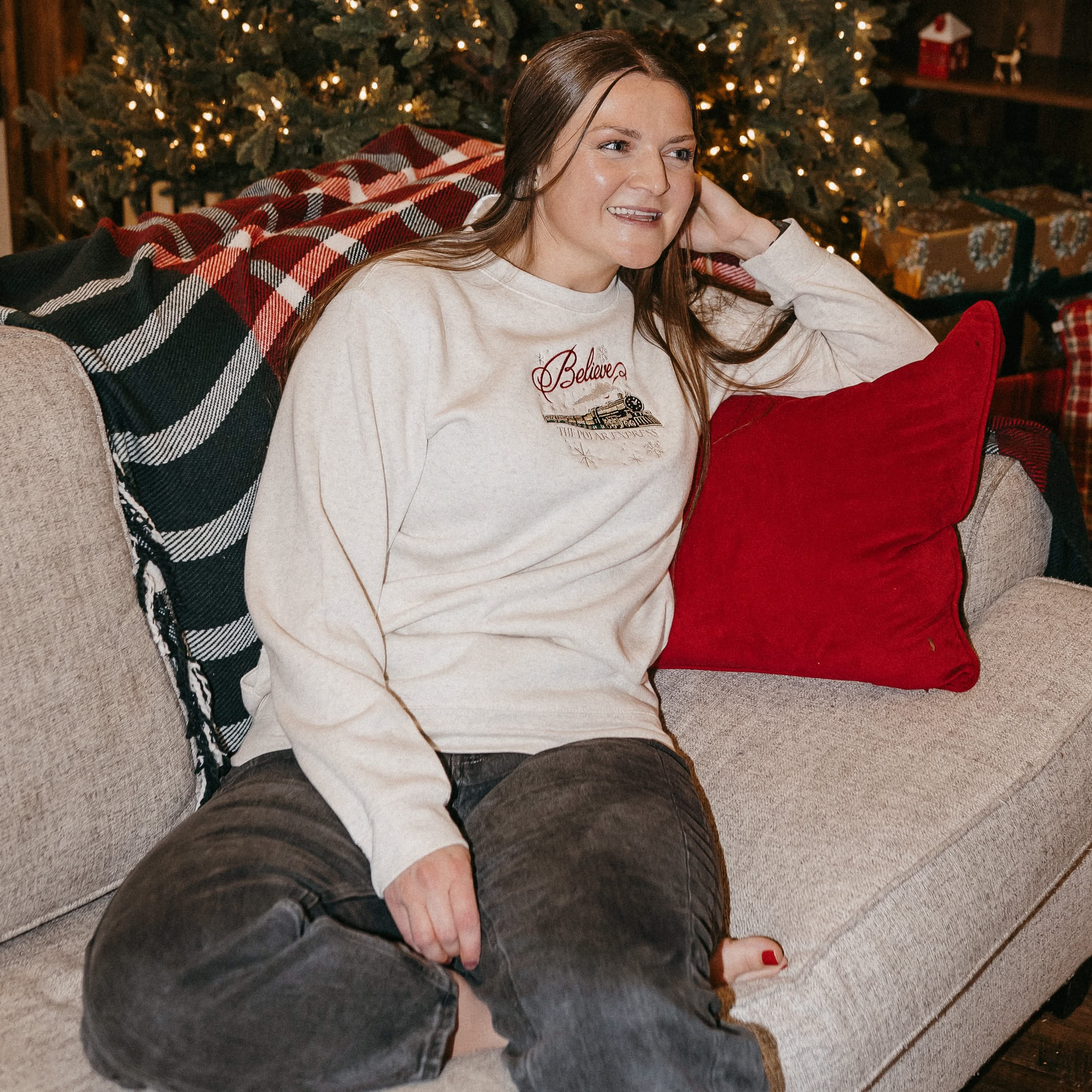 Adult sweater in heather with Believe Polar Express Train on front, shown on model – Little Mama Shirt Shop