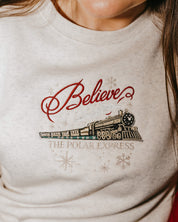 Adult sweater in heather with Believe Polar Express Train on front, shown on model – Little Mama Shirt Shop
