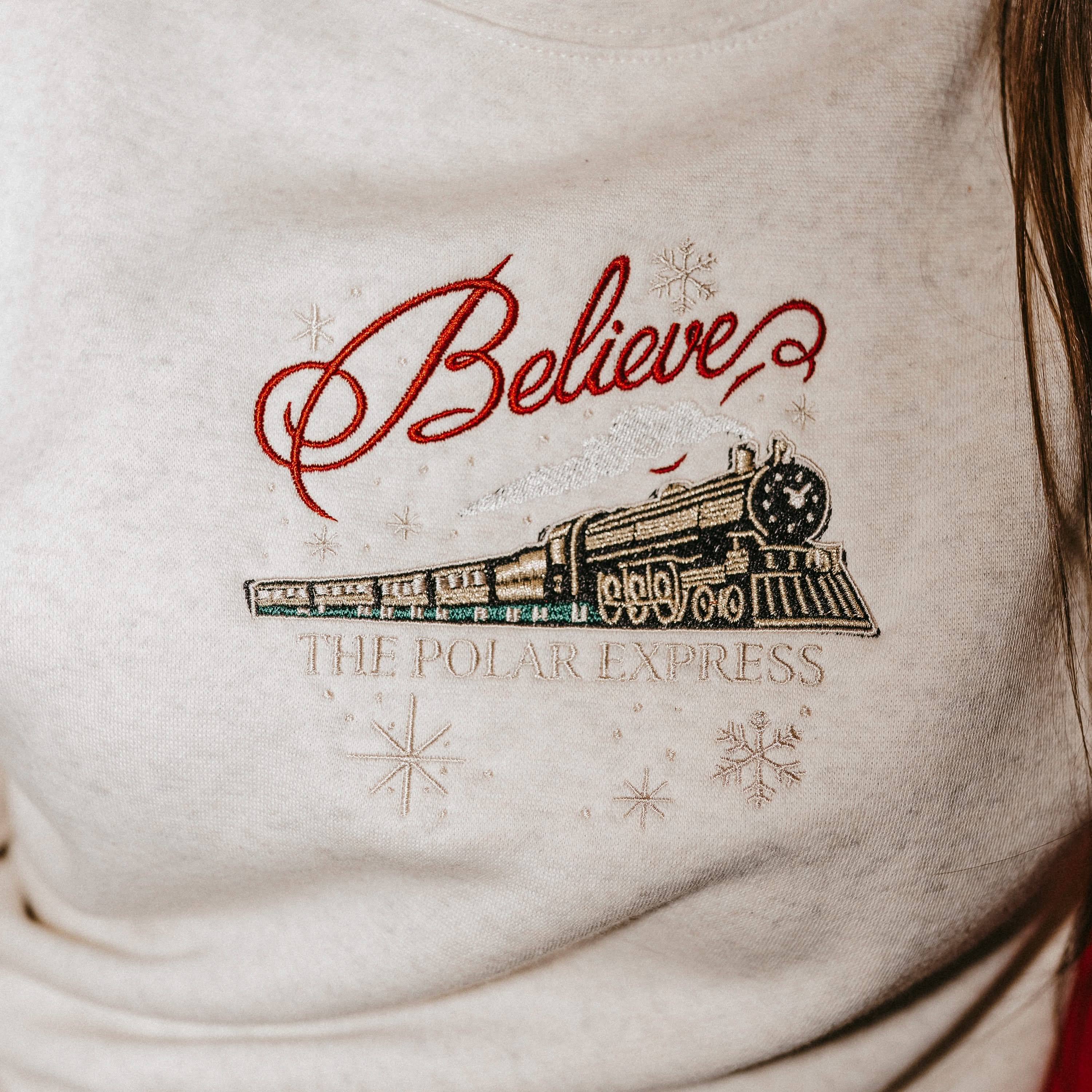 Child sweater in heather with Believe Polar Express Train on front, shown on model – Little Mama Shirt Shop