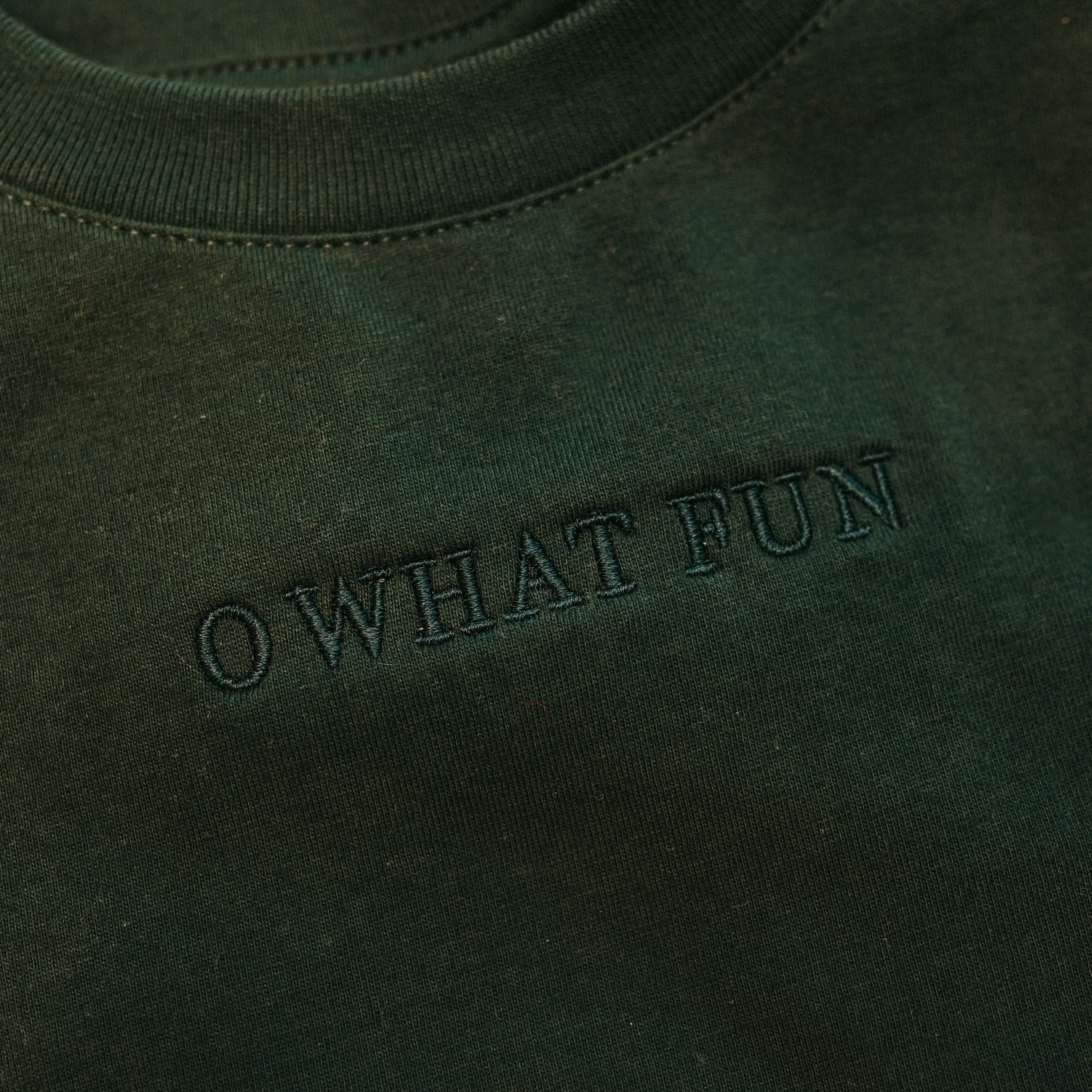 Adult tee in forest with Christmas message on front, shown on flat lay – Little Mama Shirt Shop