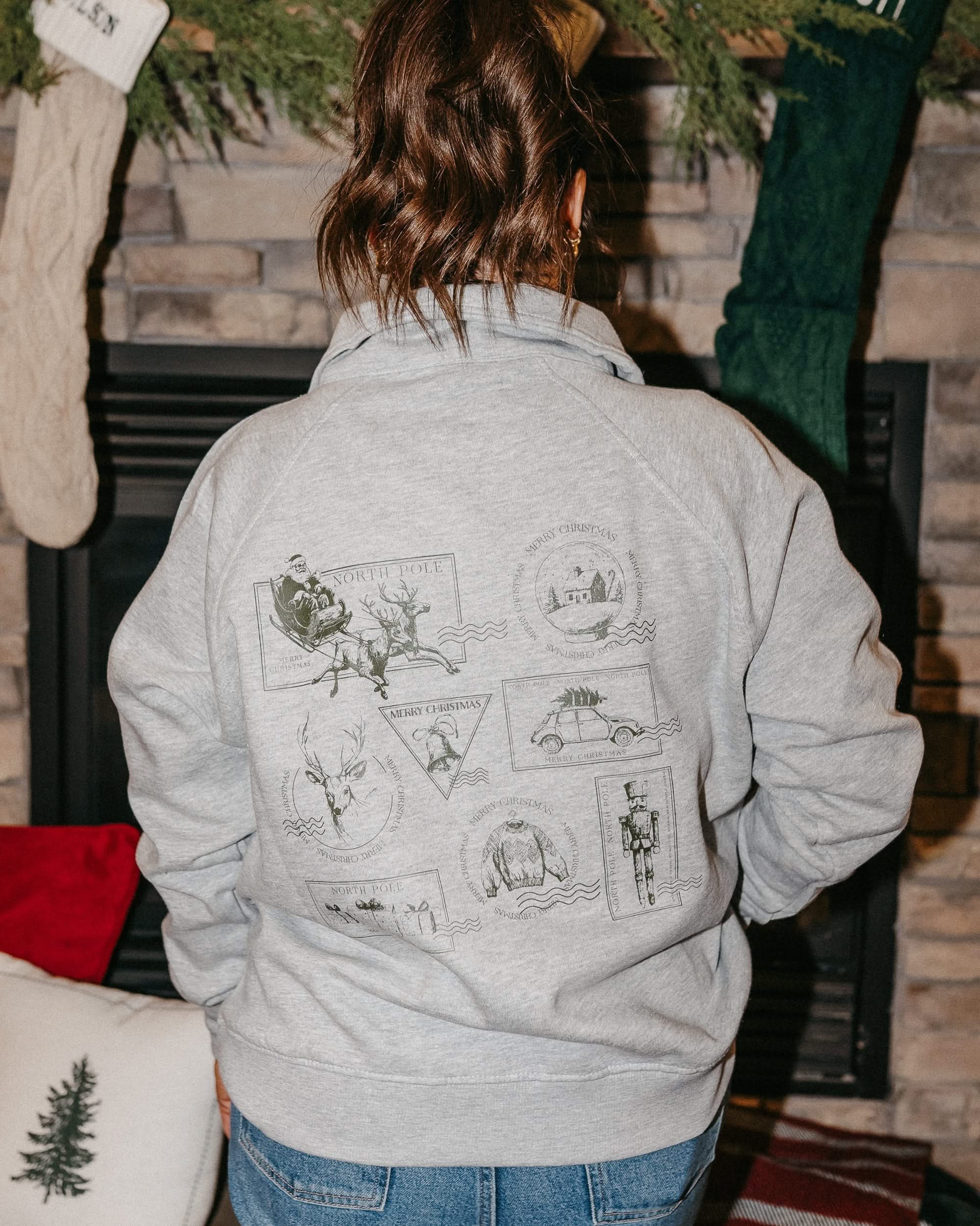 Adult quarter zip in heather with Christmas stamps printed on back, shown on model – Little Mama Shirt Shop