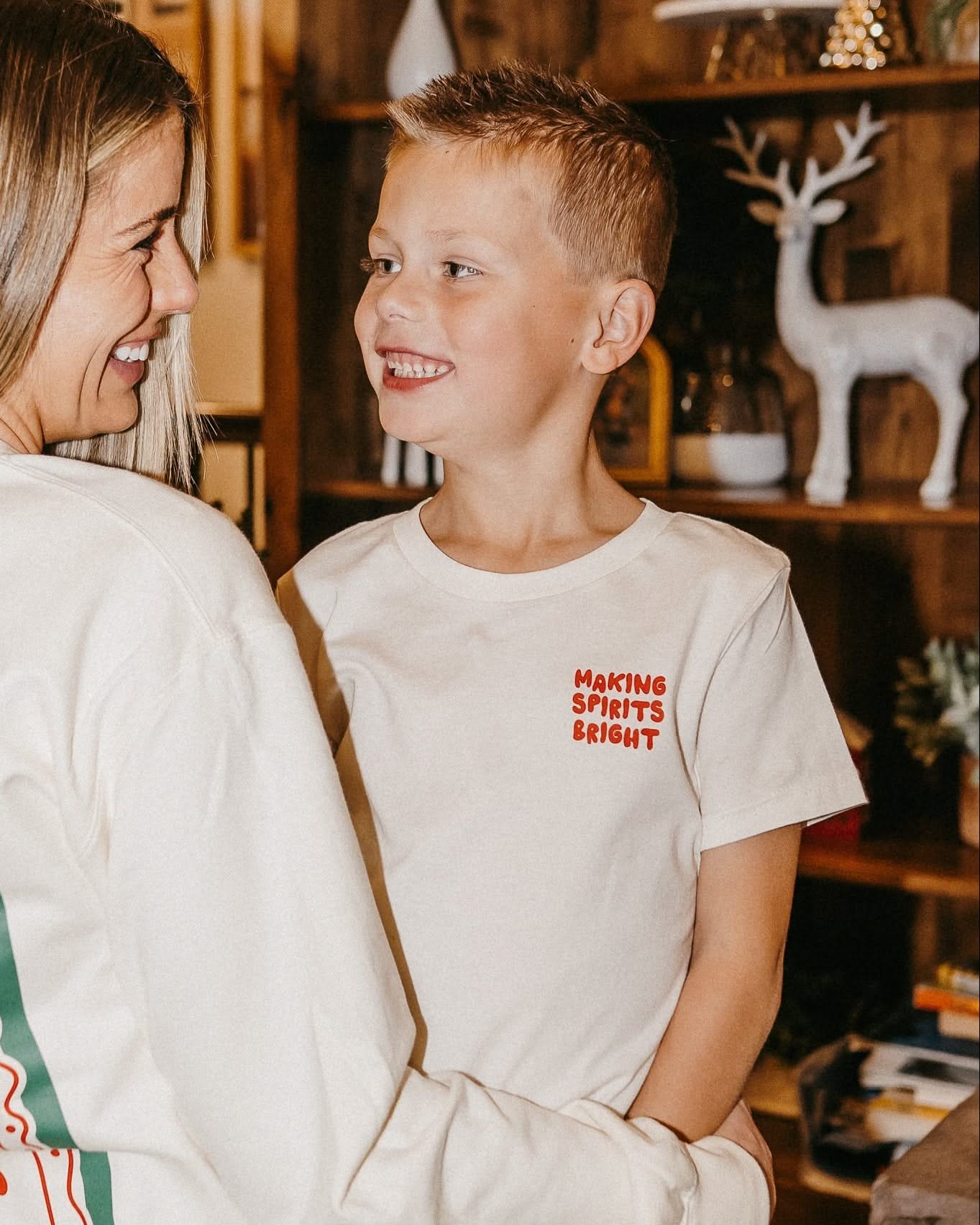 Child natural tee with 'making spirits bright' graphic, shown on model – Little Mama Shirt Shop