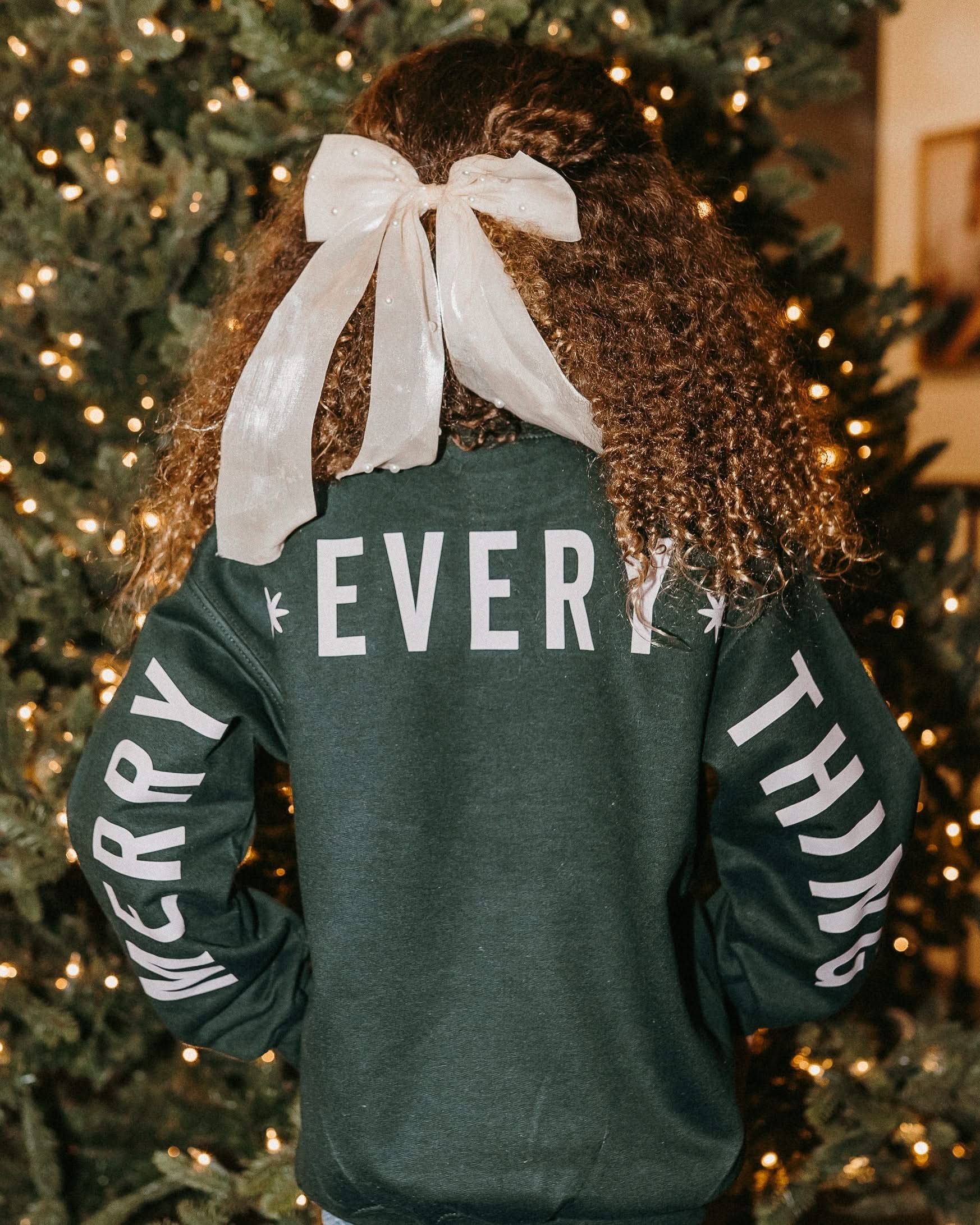 Child forest sweater with 'Merry Every Thing' graphic, shown on model – Little Mama Shirt Shop