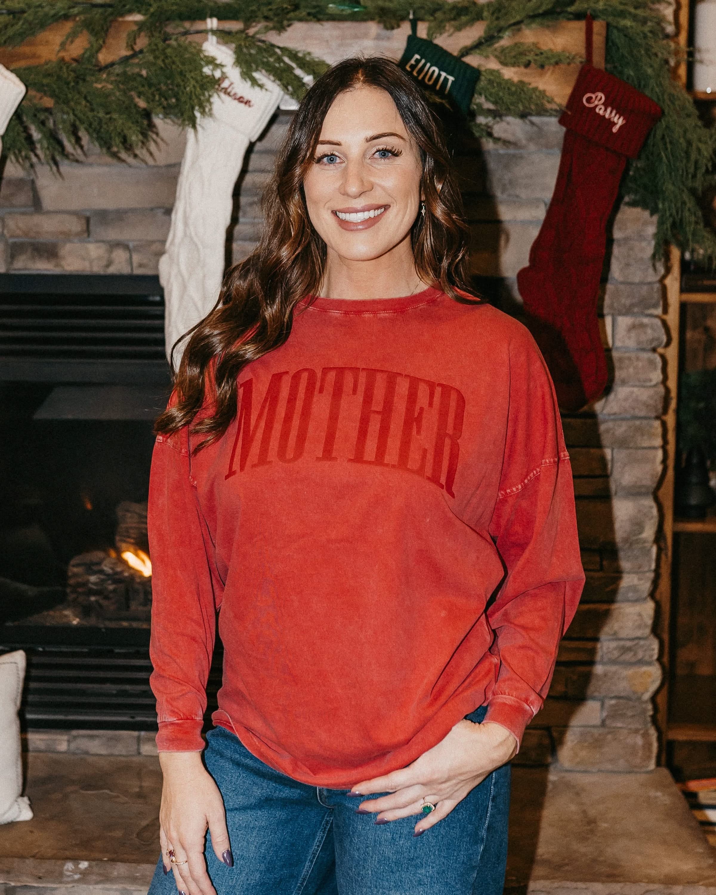 Adult oversize red tee with 'mother' in puff print on the front, shown on model – Little Mama Shirt Shop