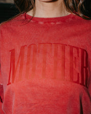 Adult oversize red tee with 'mother' in puff print on the front, shown on model – Little Mama Shirt Shop