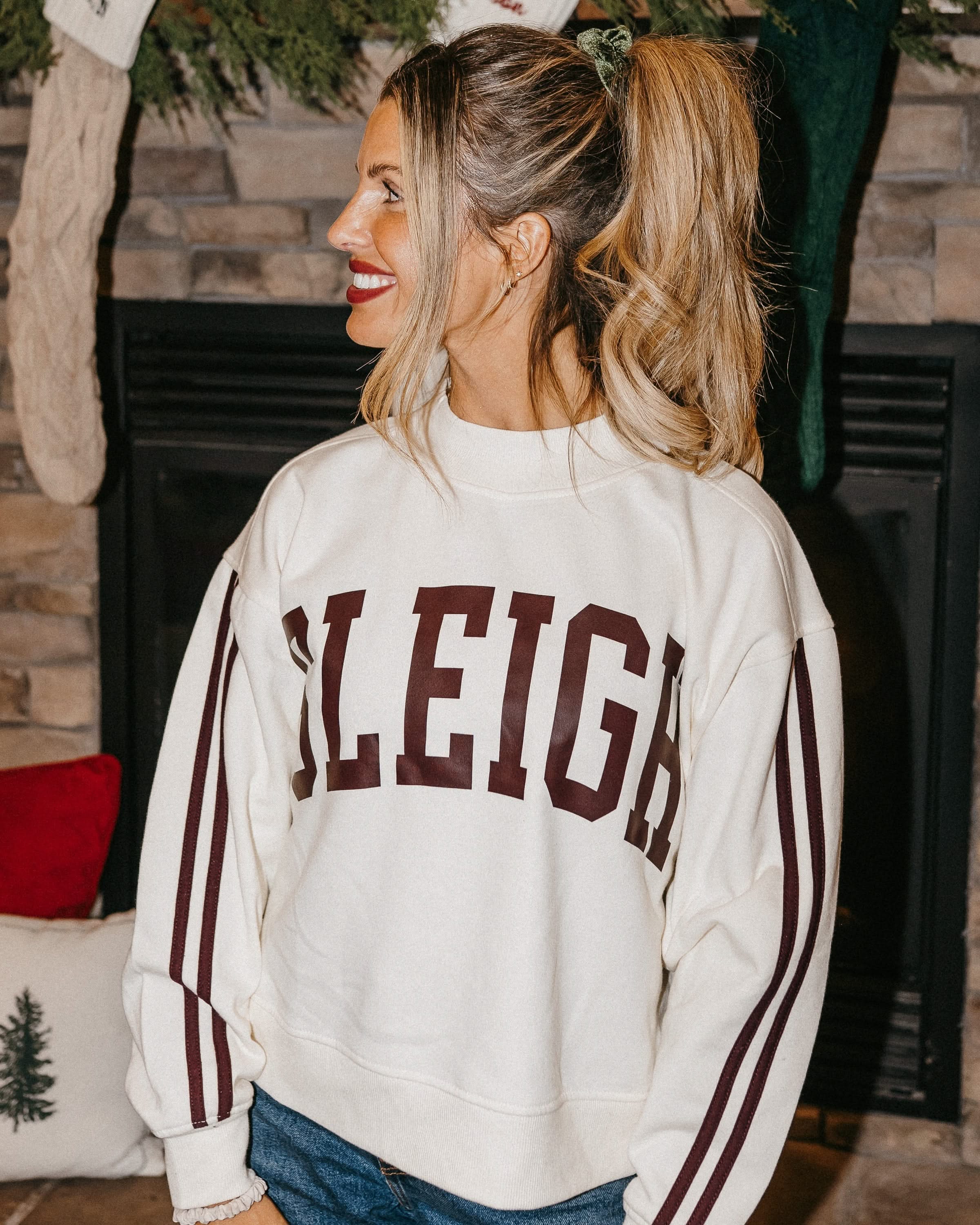 Adult mock neck sweater with varsity stripes down the arms  in white with 'sleigh' graphic on front, shown on model – Little Mama Shirt Shop