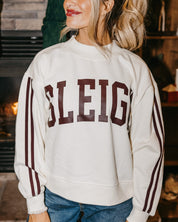 Adult mock neck sweater with varsity stripes down the arms  in white with 'sleigh' graphic on front, shown on model – Little Mama Shirt Shop