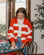 Adult candy cane cardigan with 'mother' embroidered on sleeve, shown on model – Little Mama Shirt Shop