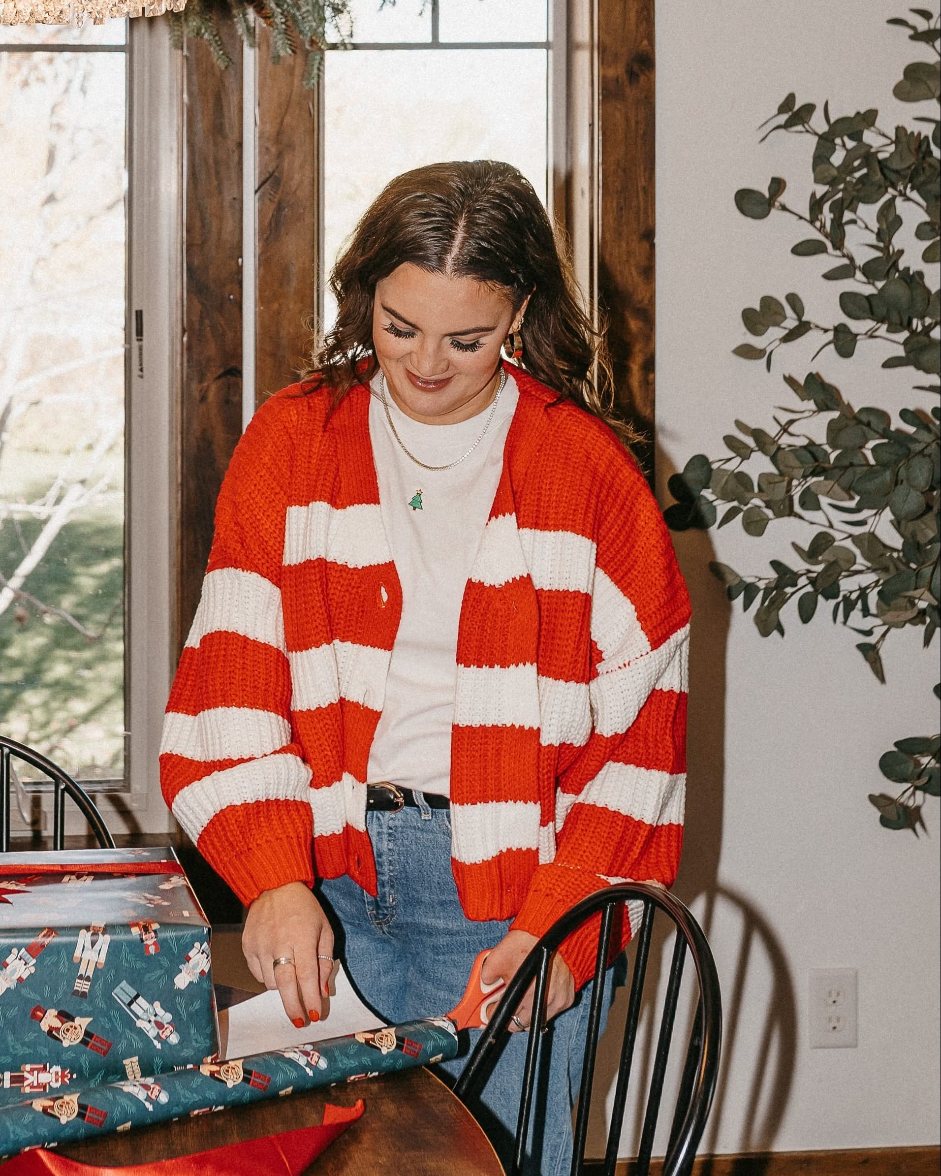 Adult candy cane cardigan with 'mother' embroidered on sleeve, shown on model – Little Mama Shirt Shop