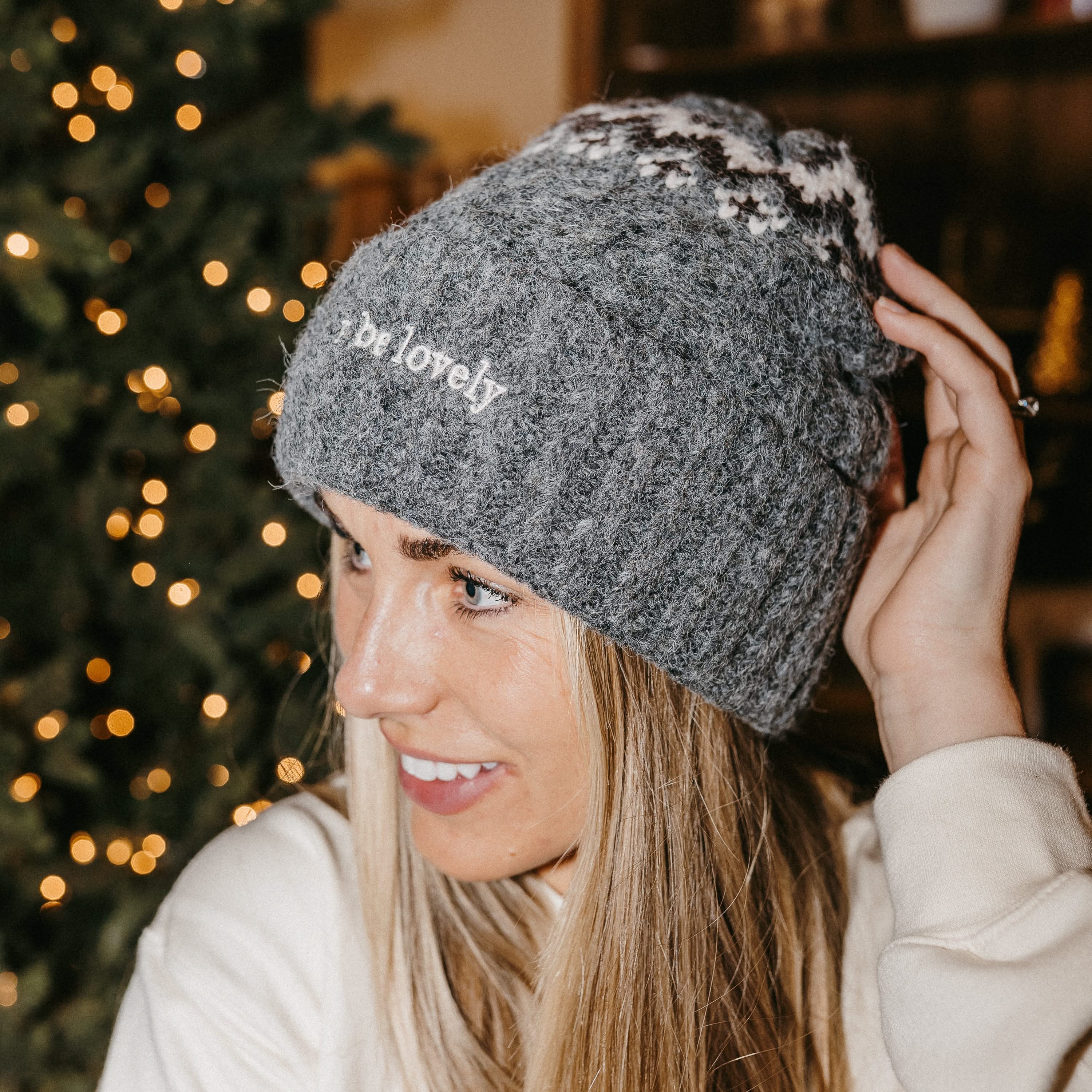 Adult beanie in gray with 'let it be lovely' design on brim, shown on model– Little Mama Shirt Shop