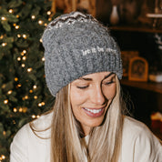 Adult beanie in gray with 'let it be lovely' design on brim, shown on model– Little Mama Shirt Shop