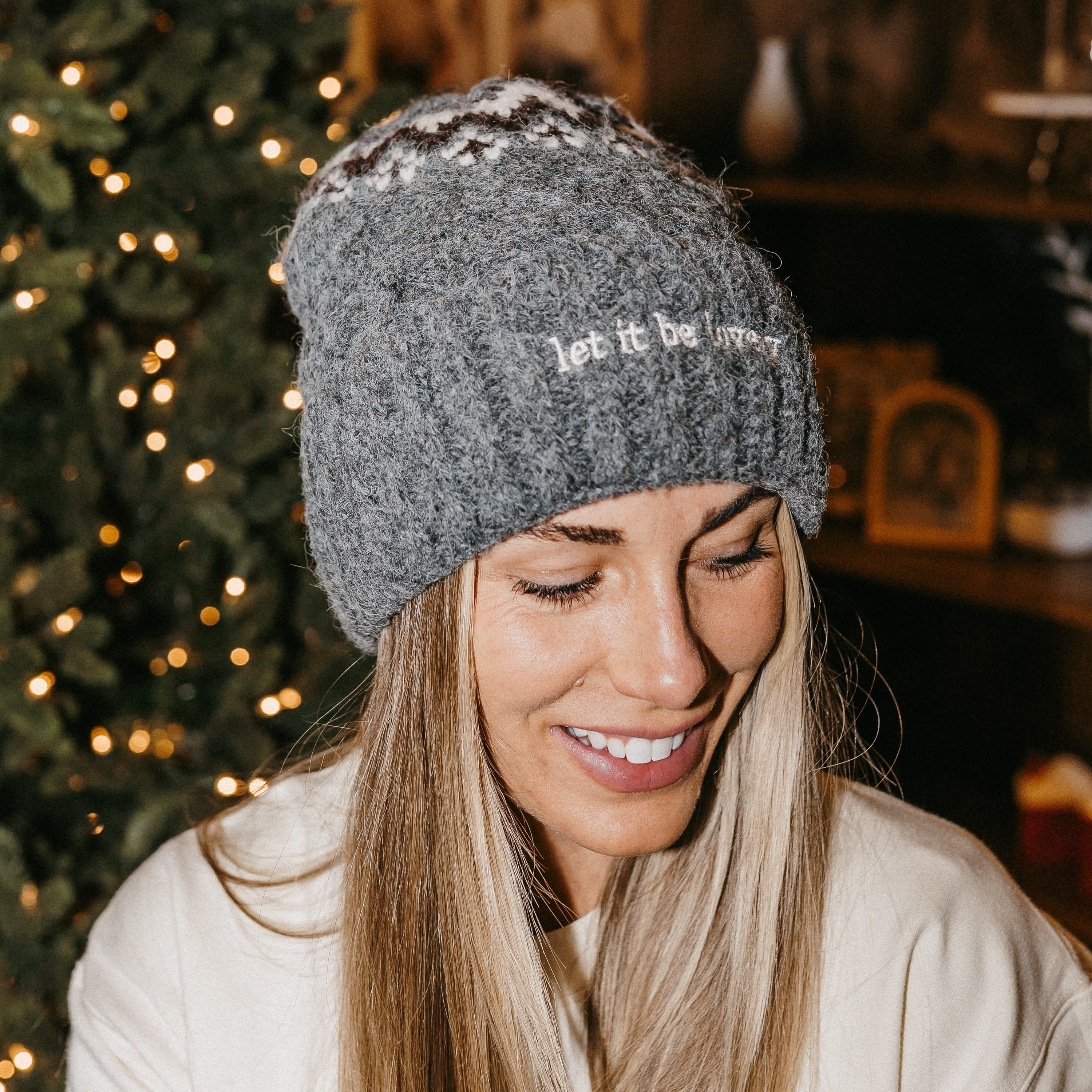 Adult beanie in gray with 'let it be lovely' design on brim, shown on model– Little Mama Shirt Shop