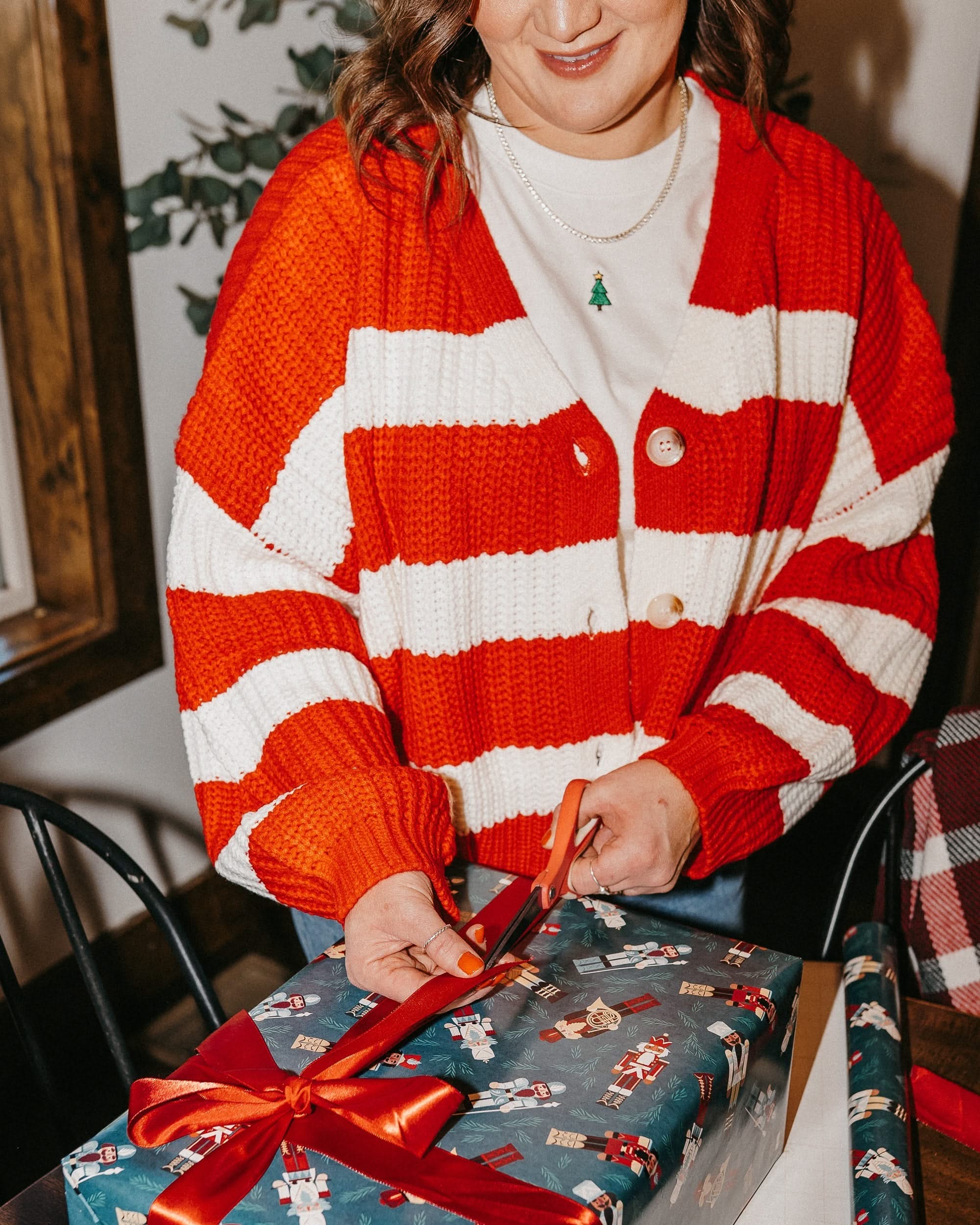 Adult candy cane cardigan with 'mother' embroidered on sleeve, shown on model – Little Mama Shirt Shop