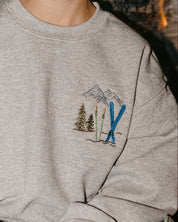 Child sweater in gray with embroidered ski pattern, shown on model – Little Mama Shirt Shop