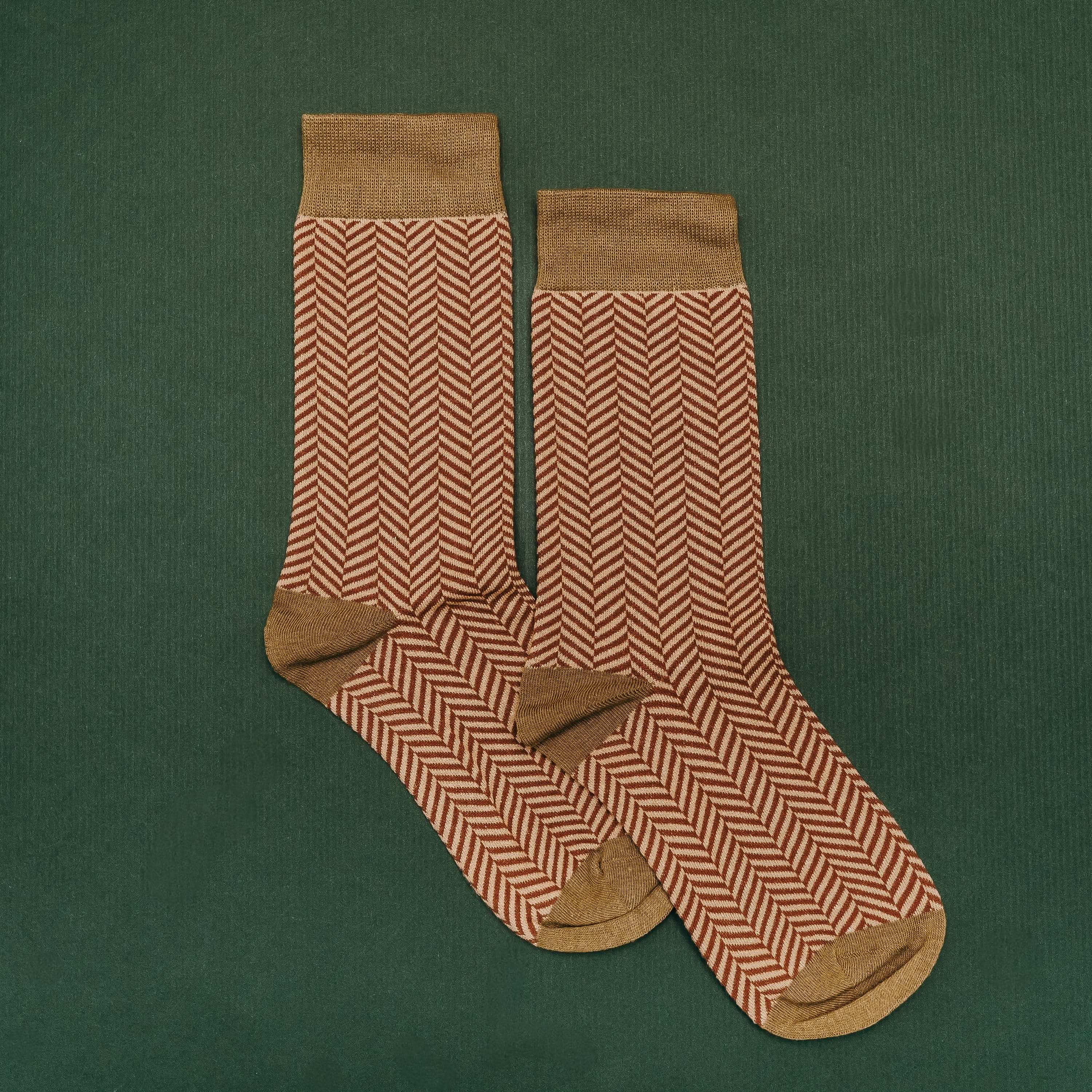 Adult socks in brown/green with chevron pattern, shown on flat lay – Little Mama Shirt Shop