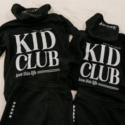 Two hoodies back view in black with white 'Kid Club' graphic on flat lay - Little Mama Shirt Shop