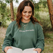 Embroidered “Will Yap About Books” pigment-dyed crewneck in pigment alpine with pink thread on model  – Little Mama Shirt Shop